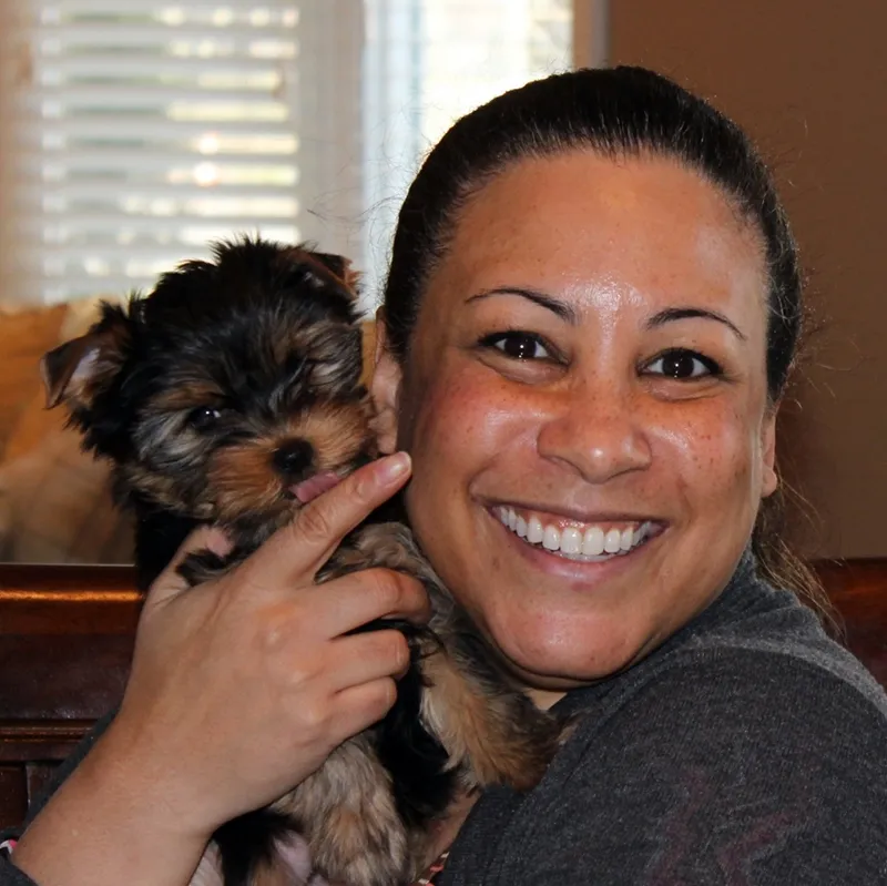Woman holding Yorkshire Terrier